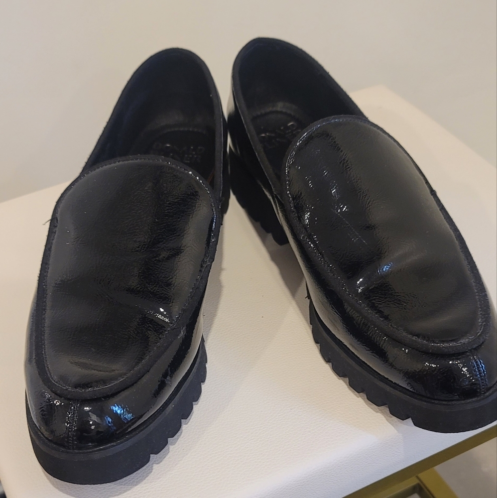 Donald Pliner black shiney loafers.  In good condition.  Just one scuff as shown
